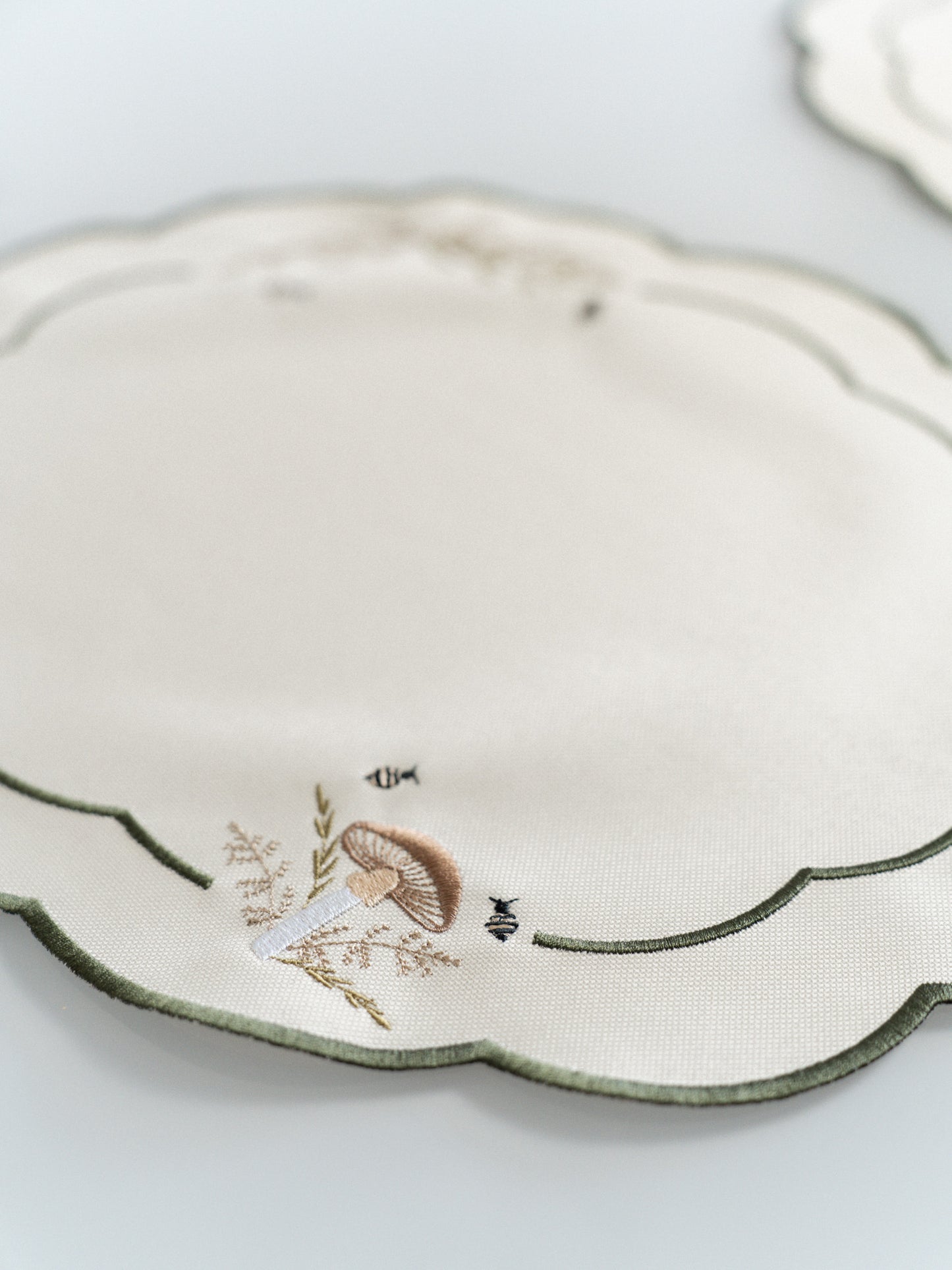 Oval Scallop Placemat - Embroidered toadstool