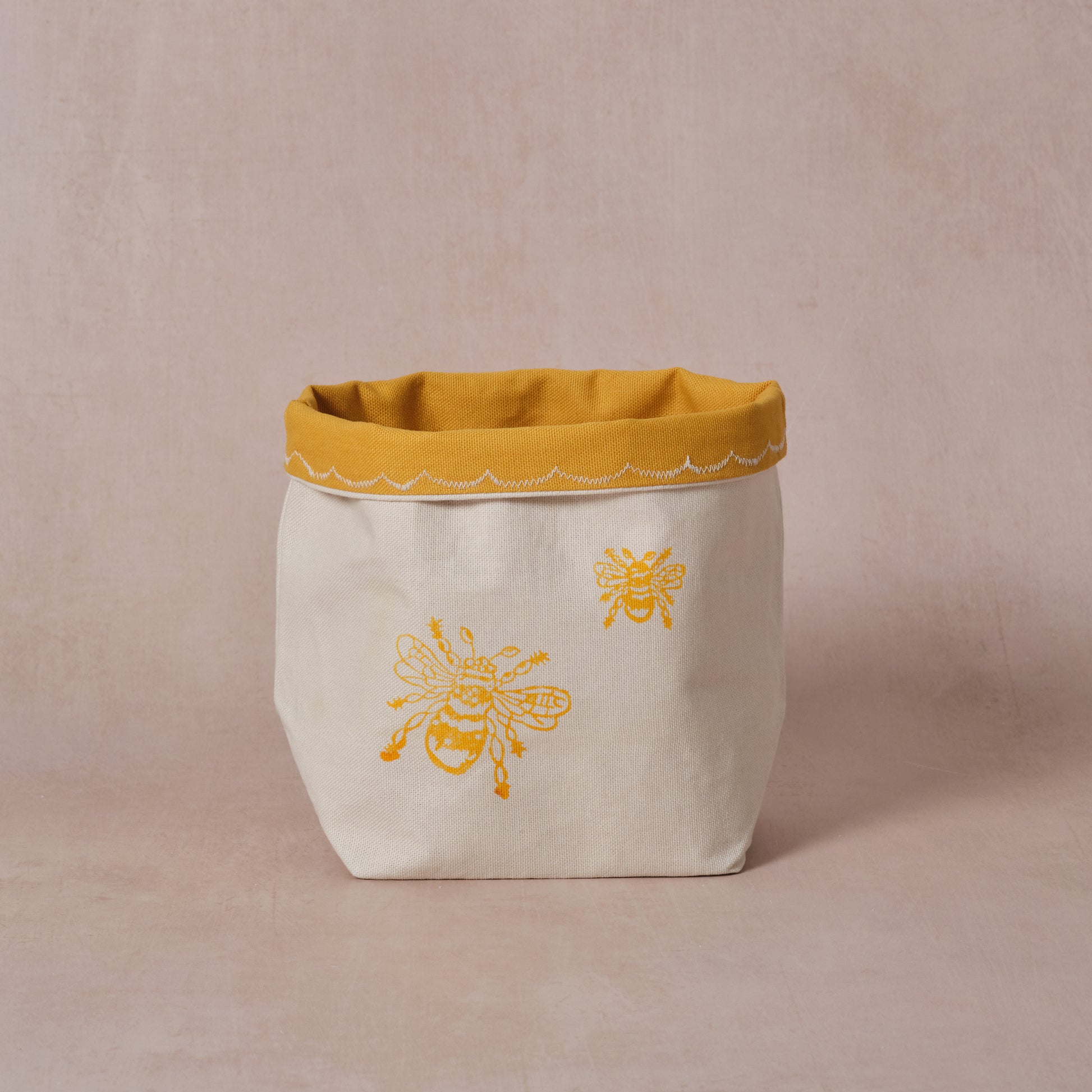 Reversible block-printed fabric storage basket in bees print, handmade cotton basket by Emena Home UK