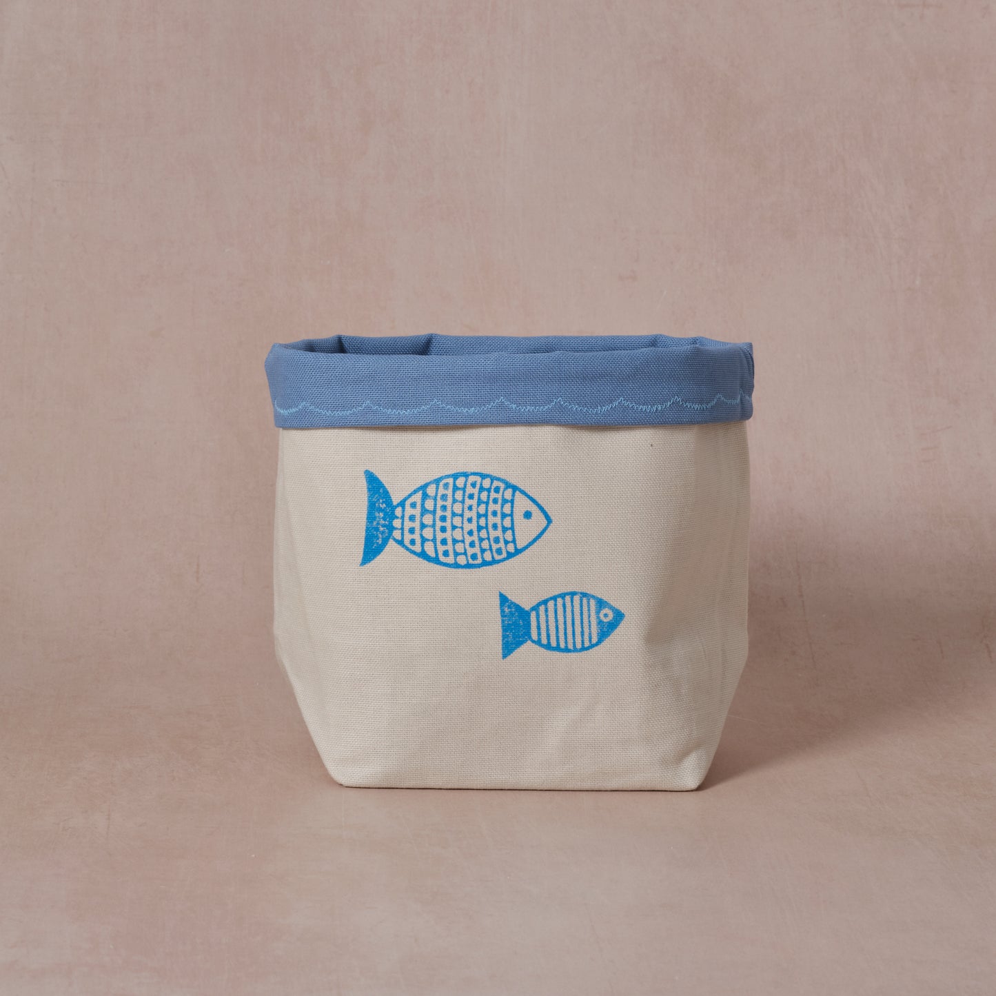 Reversible block-printed fabric storage basket in fish print, handmade cotton basket by Emena Home UK