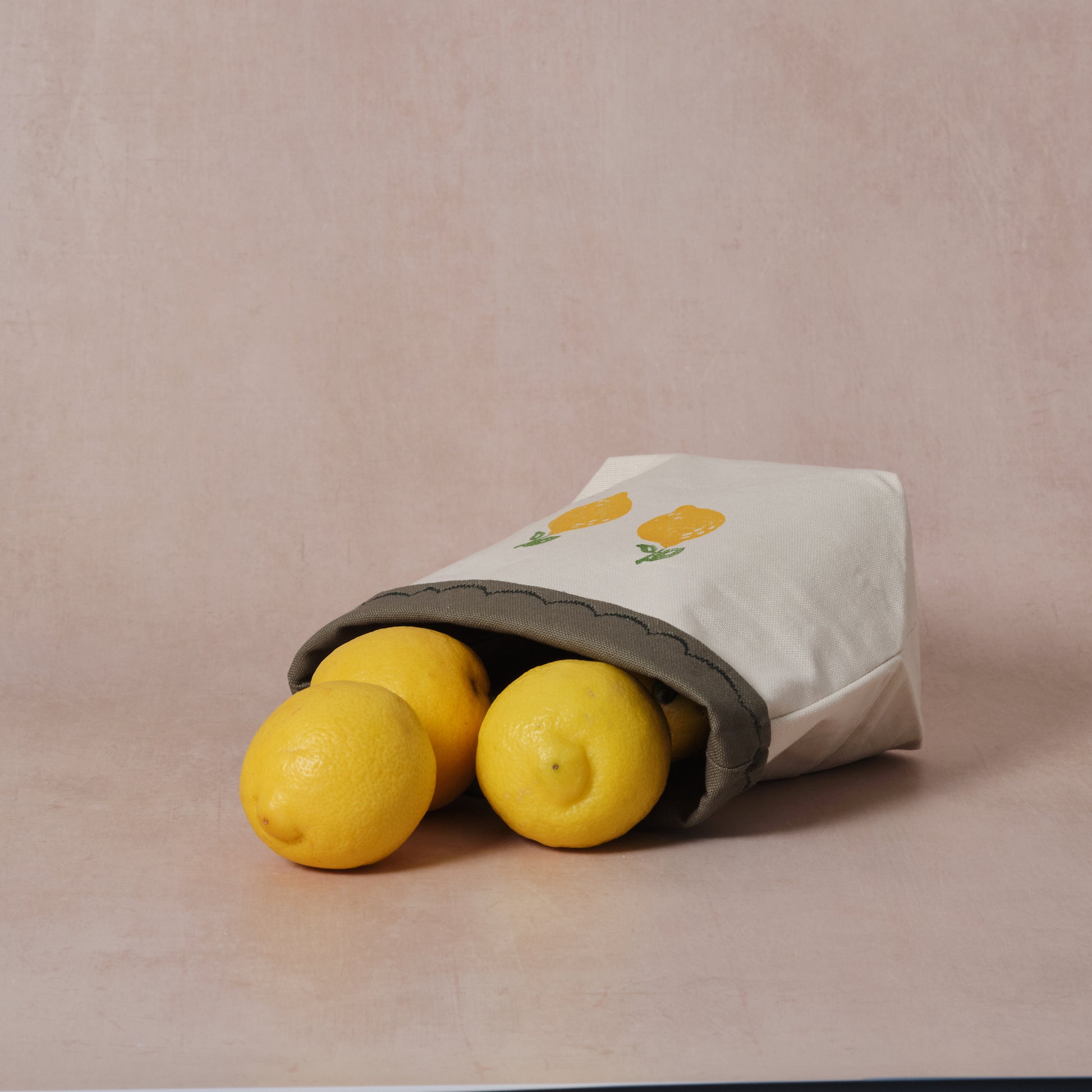 Reversible block-printed fabric storage basket in lemon print, handmade cotton basket by Emena Home UK